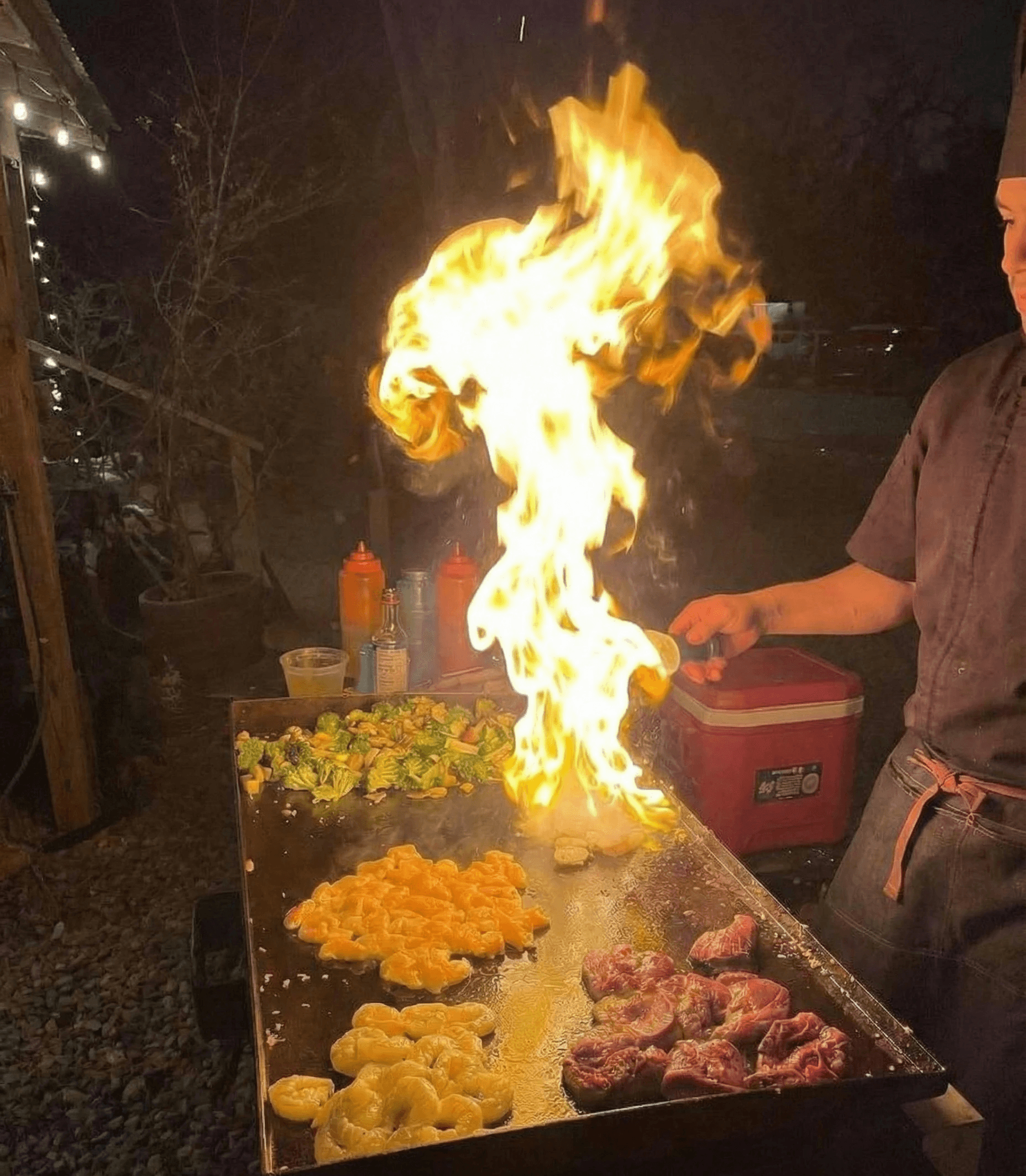 A classic golden-brown Spanish Tortilla (potato and onion omelet) on a dark gray plate, with one slice cut out and garnished with a sprig of dill, set against a dark, rustic wooden surface