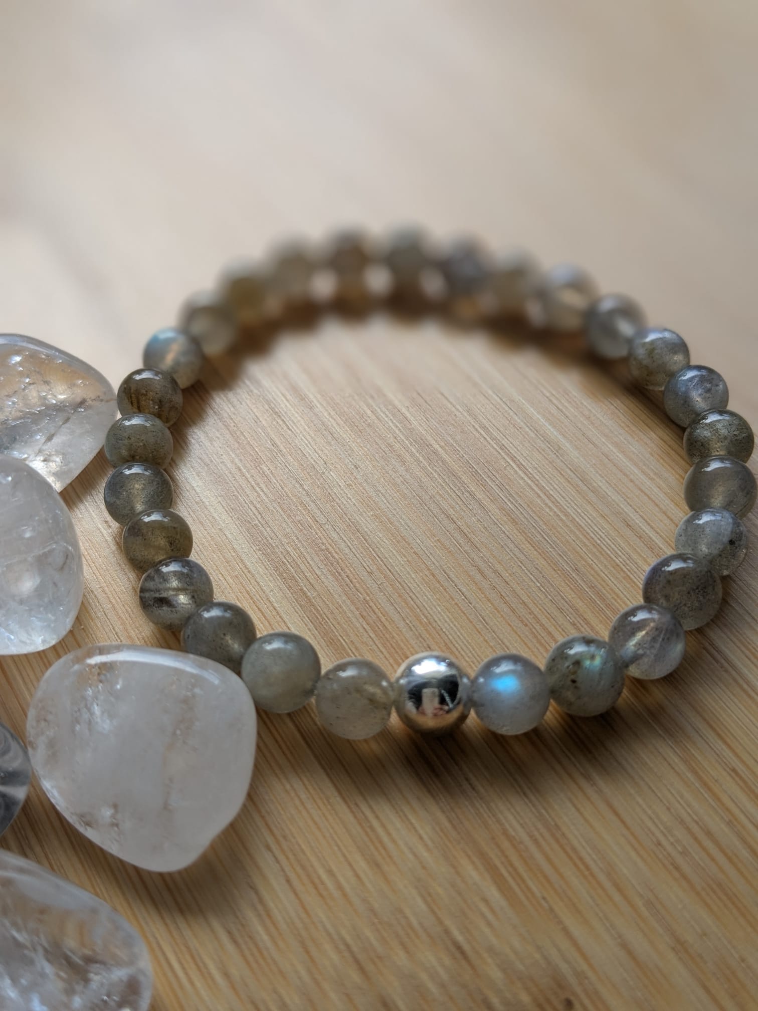 A person lying on a massage table, their face covered with a towel, bathed in warm golden light. The setting exudes relaxation and comfort.