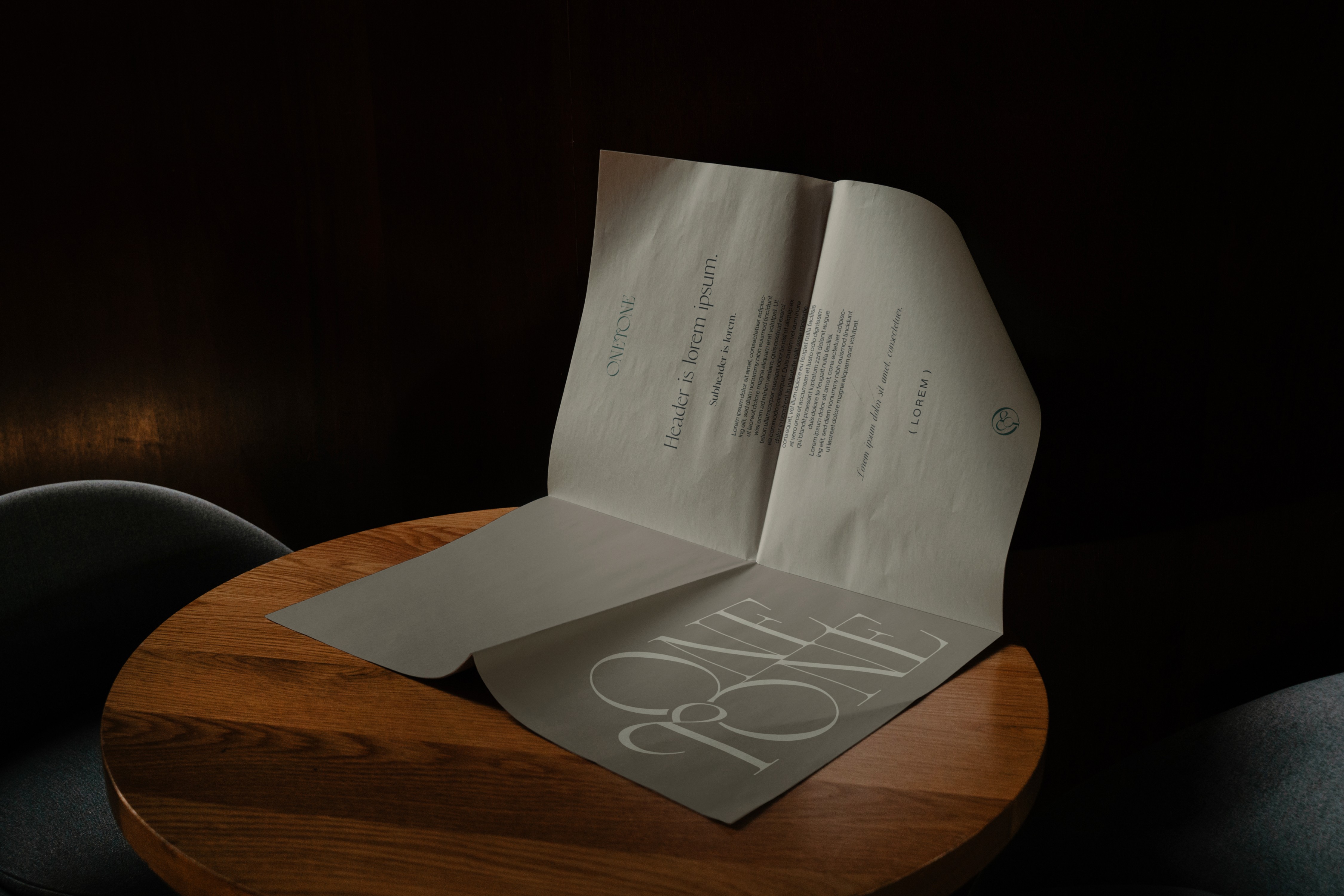 Luxury Abaya brand shopping experience – Onetone-branded invoice and shopping documents on a wooden table, emphasizing exclusivity and high-end service.