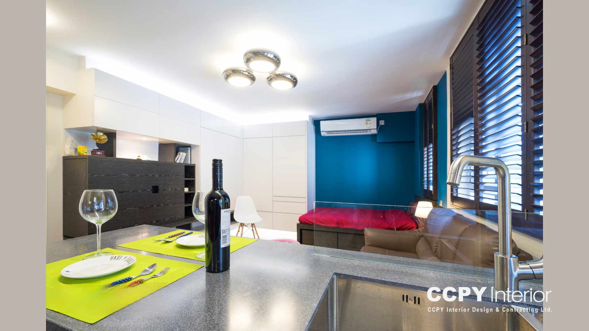 Modern luxury house interior details in Mount Pavilia with a textured area rug, dark leather seating, and abstract wall art for a curated look.