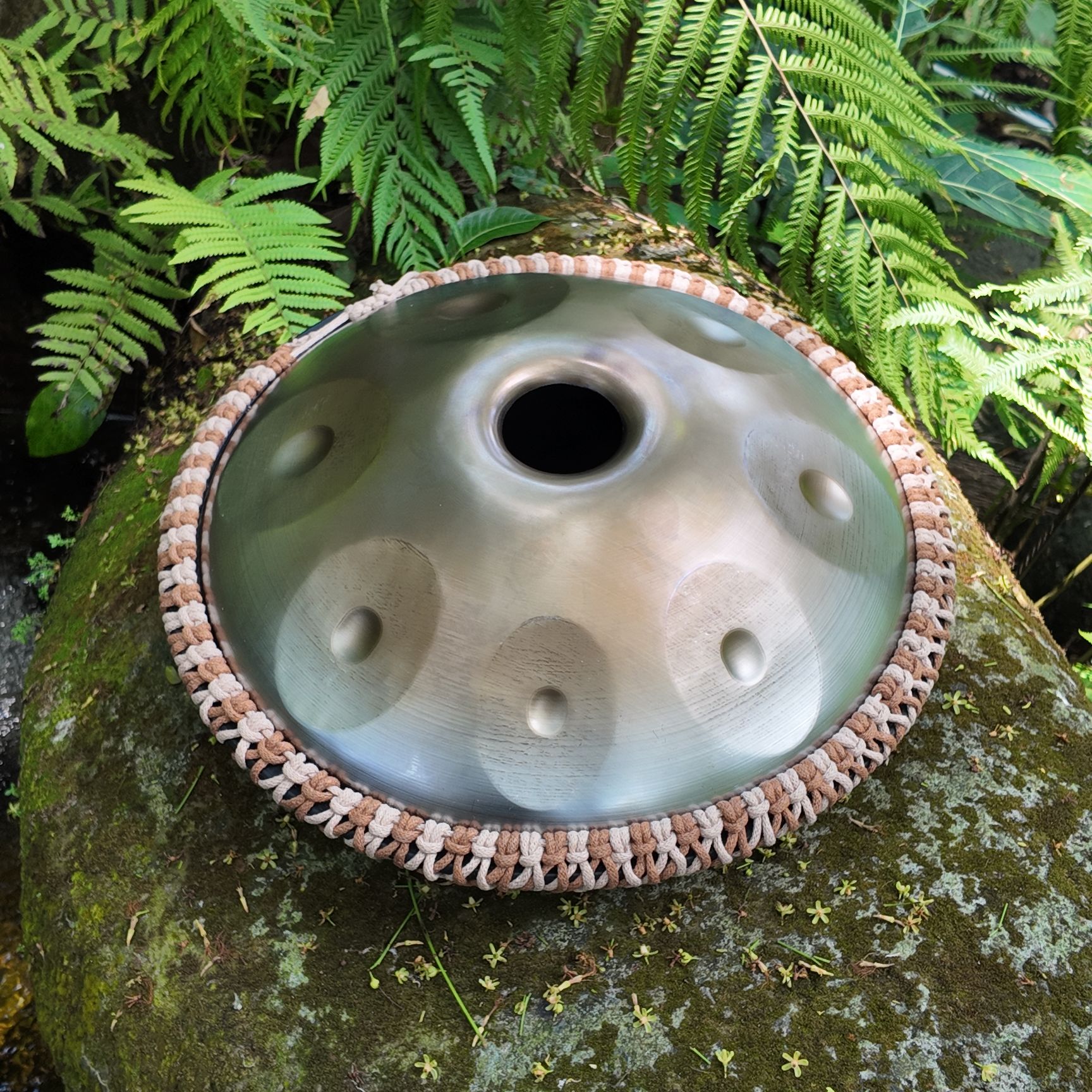 Close-up of a stainless steel handpan in Thailand.