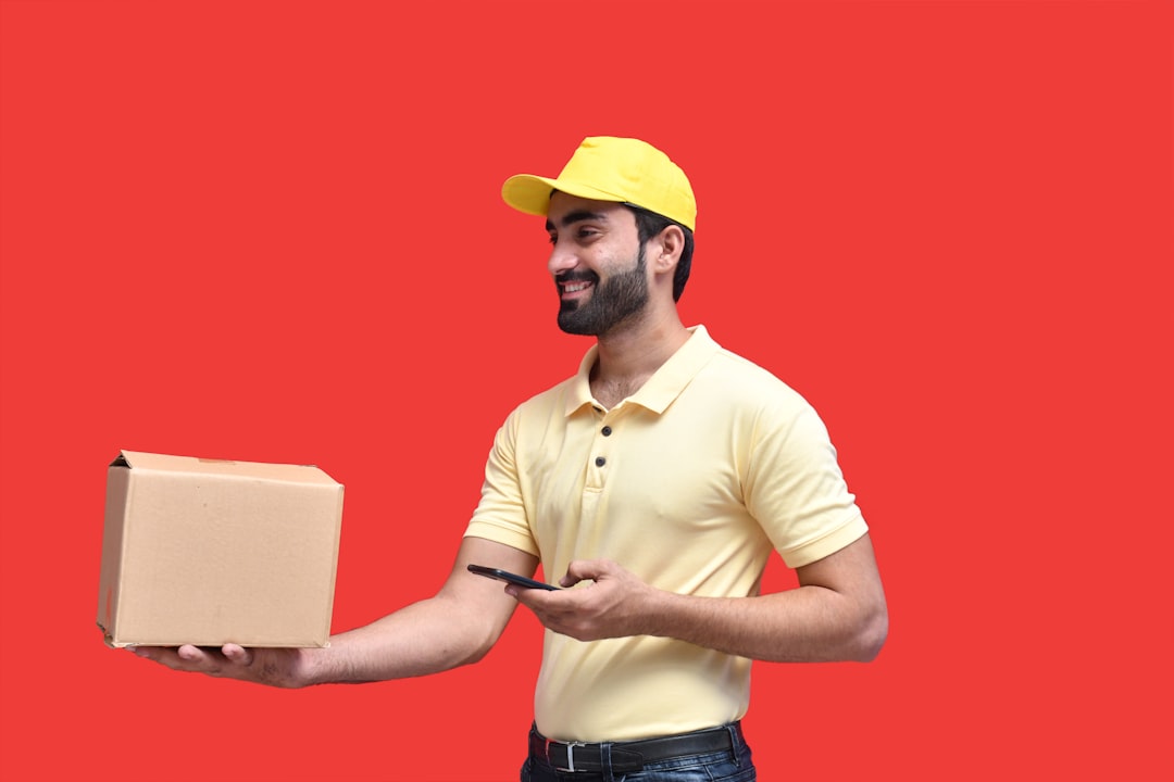 delivery driver holding a digital tablet, standing next to an electric delivery van, residential neighborhood background, morning sunlight, cinematic style