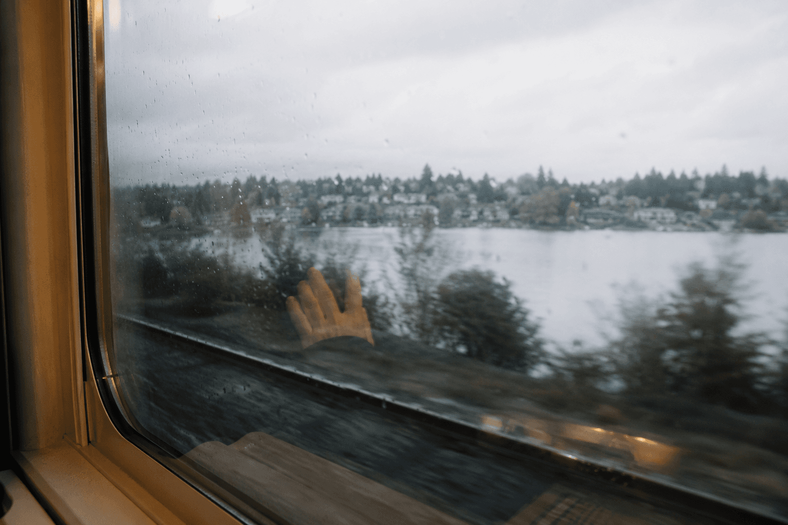 A quiet view of water through a window, photographed during a reflective pause