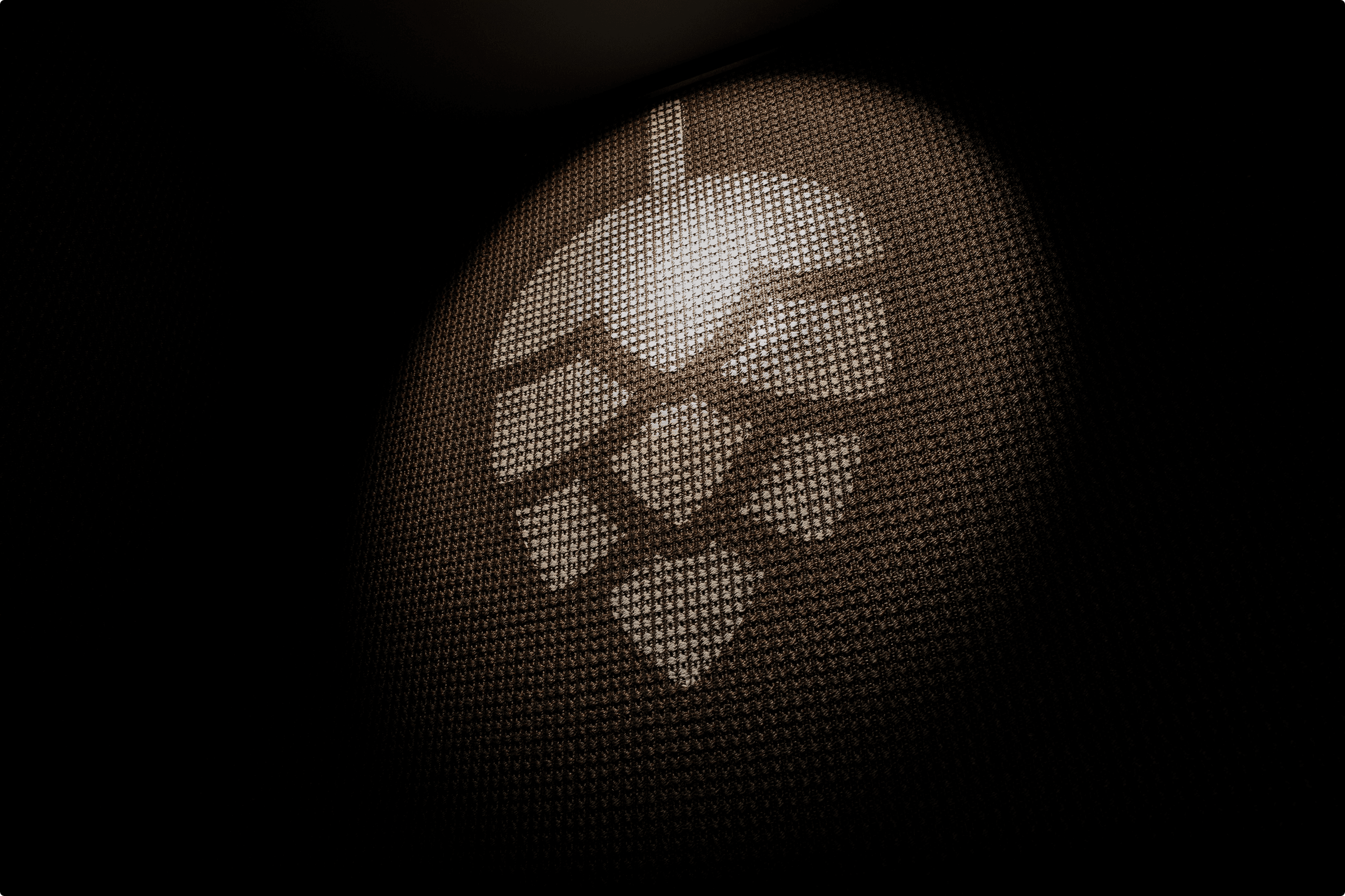 Lighted hop icon on textured surface.