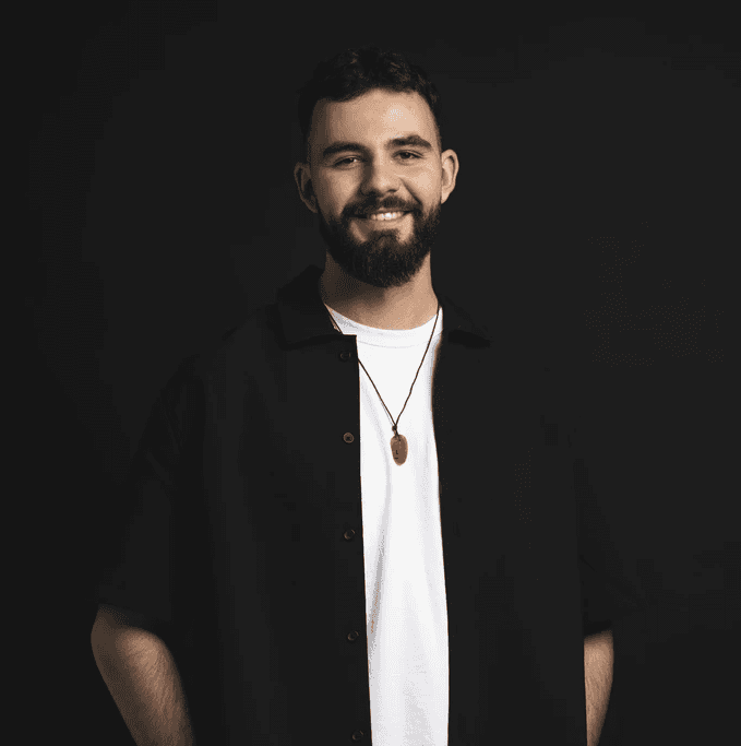 grayscale photography of man wearing crew-neck shirt