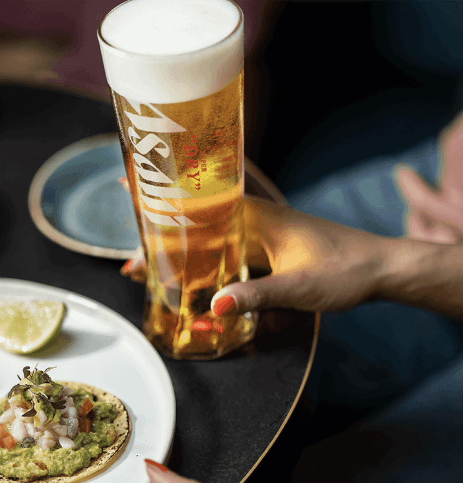Asahi beer standing in a tall glass
