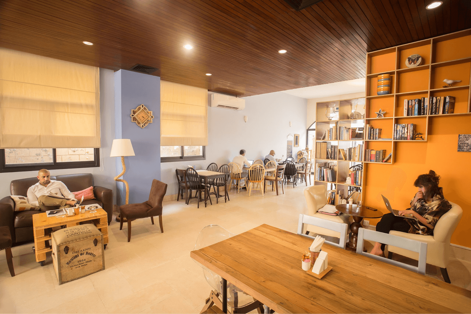 Casual and cosy cafe with book-lined shelves and a homey atmosphere at Third Place Cafe in Abu Dhabi.