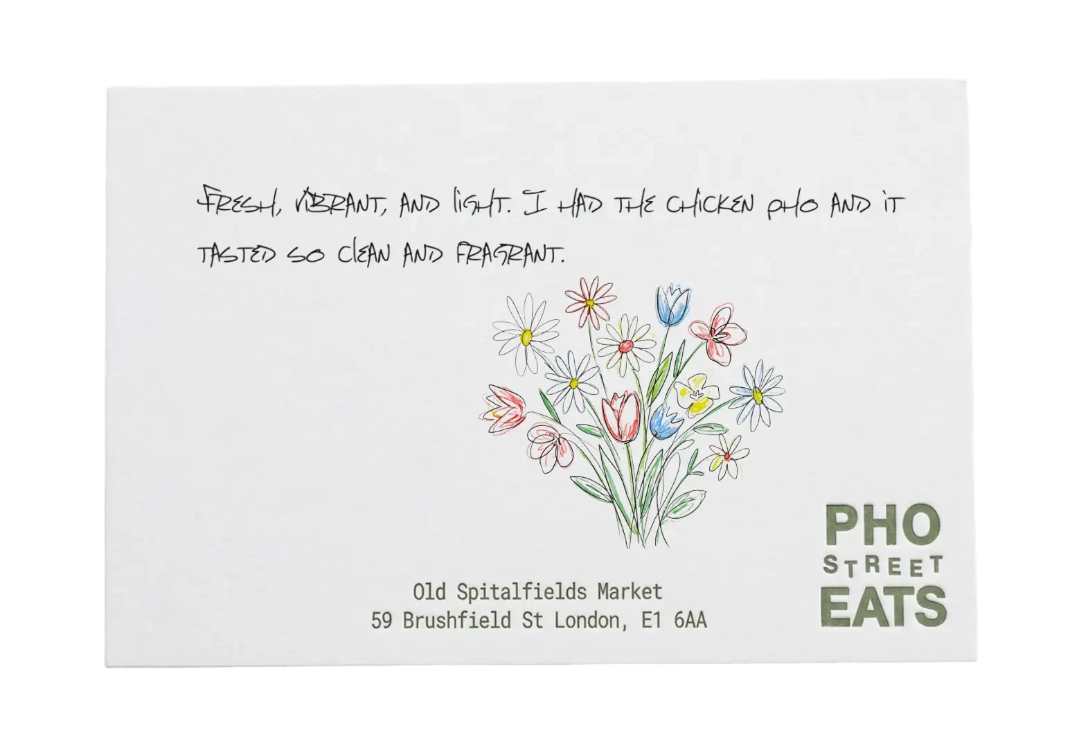 Pho Street Eats review card with a flower bouquet, praising the chicken pho.