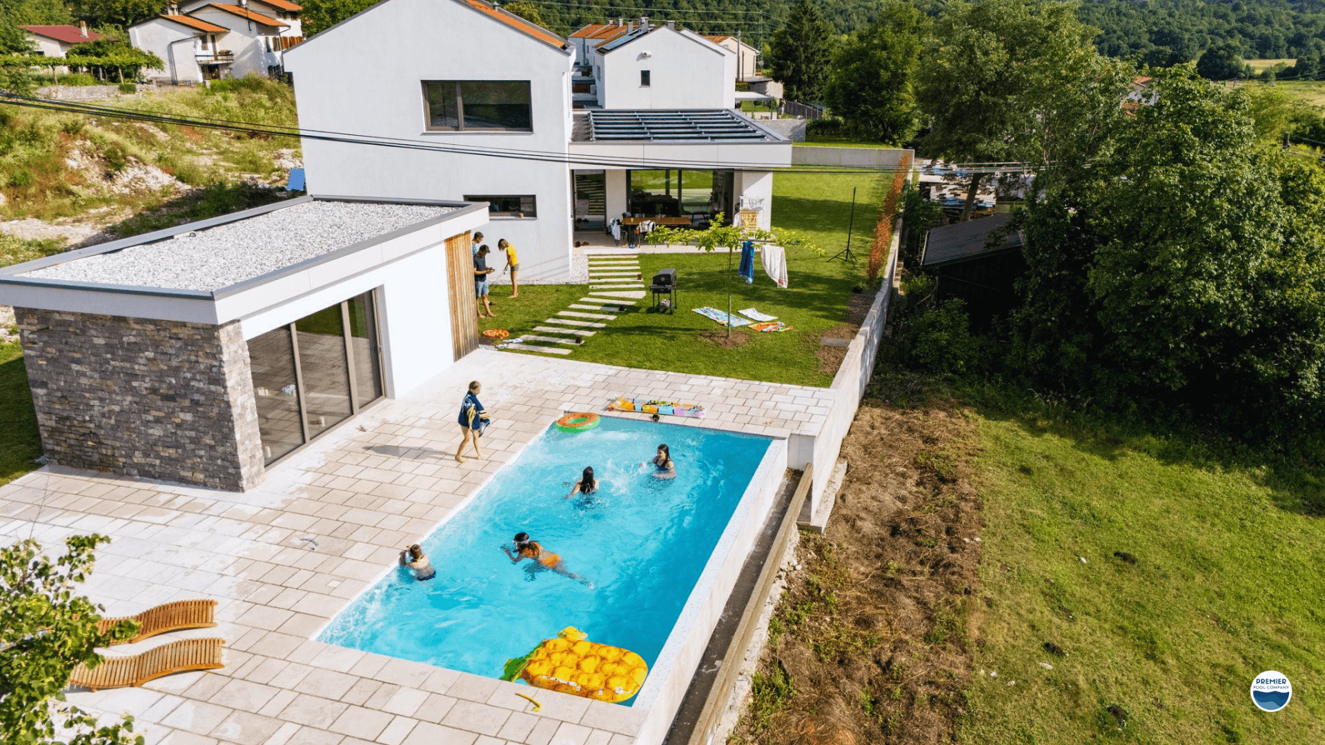 Fiberglass pool cost example in Ohio backyard with simple decking and landscaping