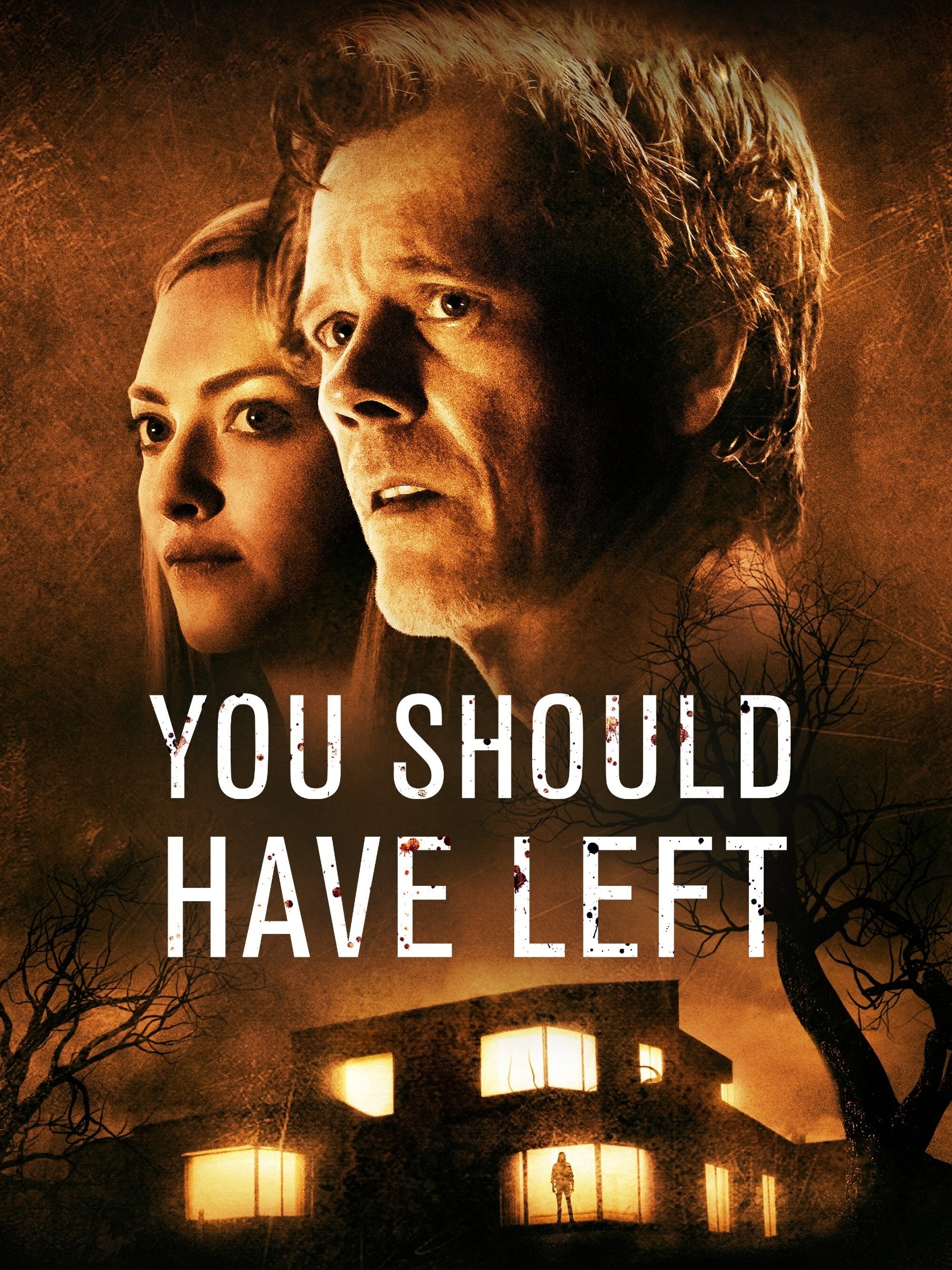 Movie poster showing a worried couple above a glowing house at night, title “You Should Have Left.”