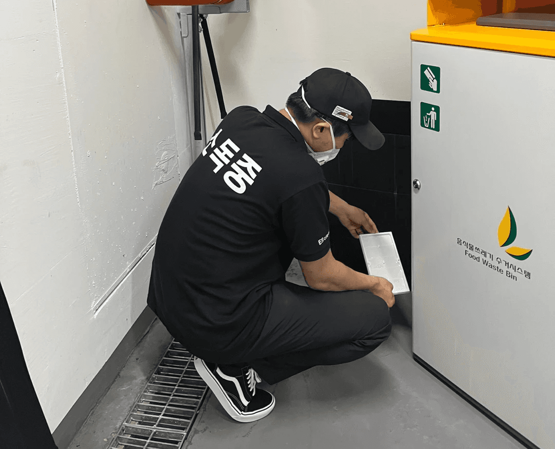 a man disinfecting the front mat