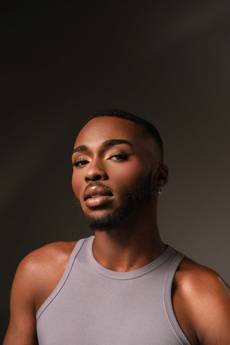 a woman holding a red flower