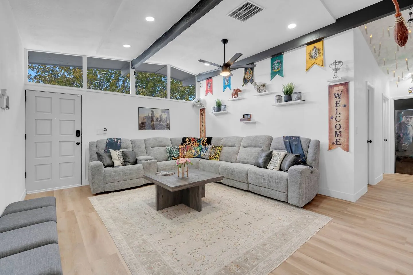 Living room sectional under exposed ceiling beams, Wizard’s Dream in North Las Vegas