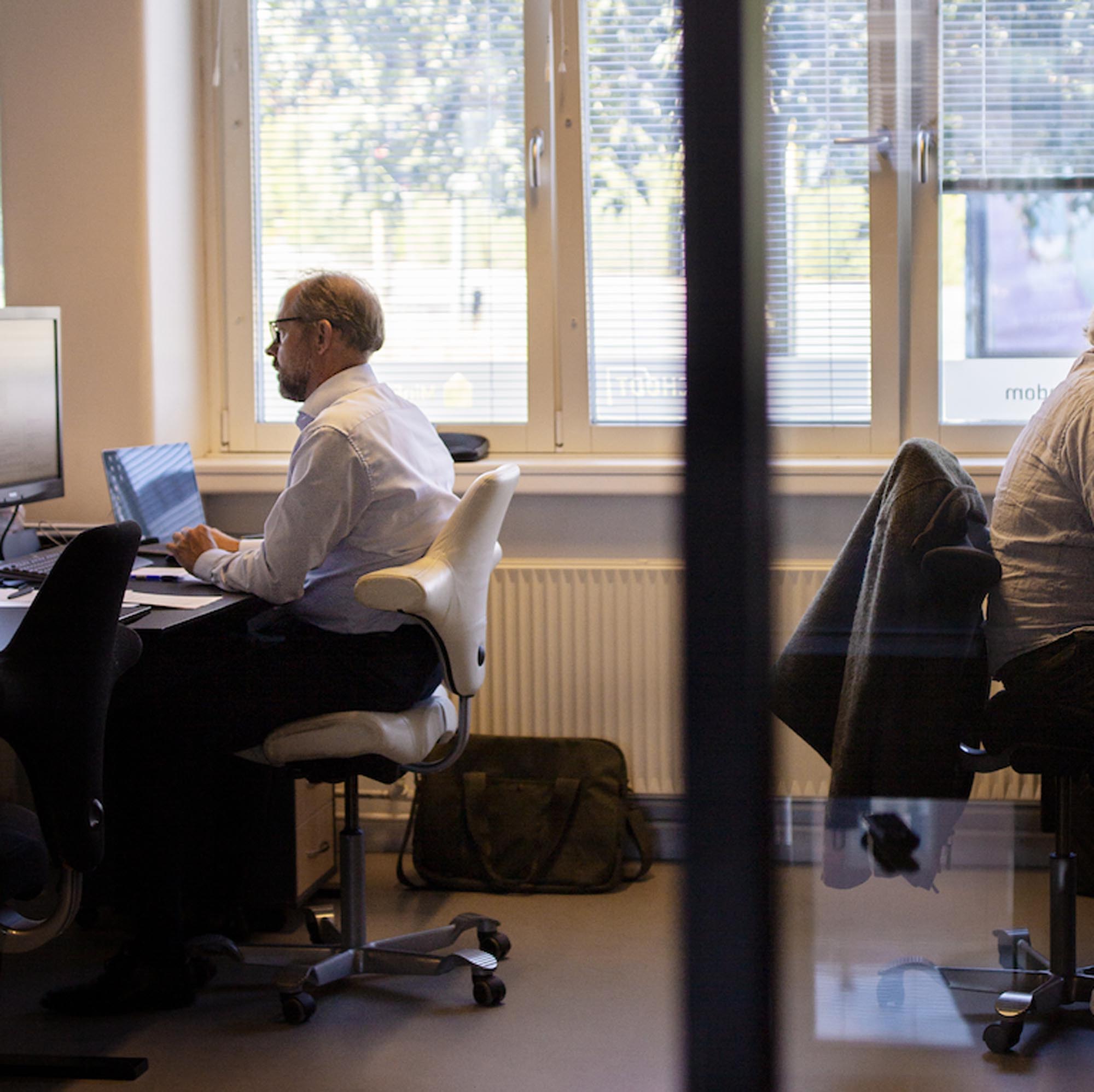 cars on road near buildings during daytime