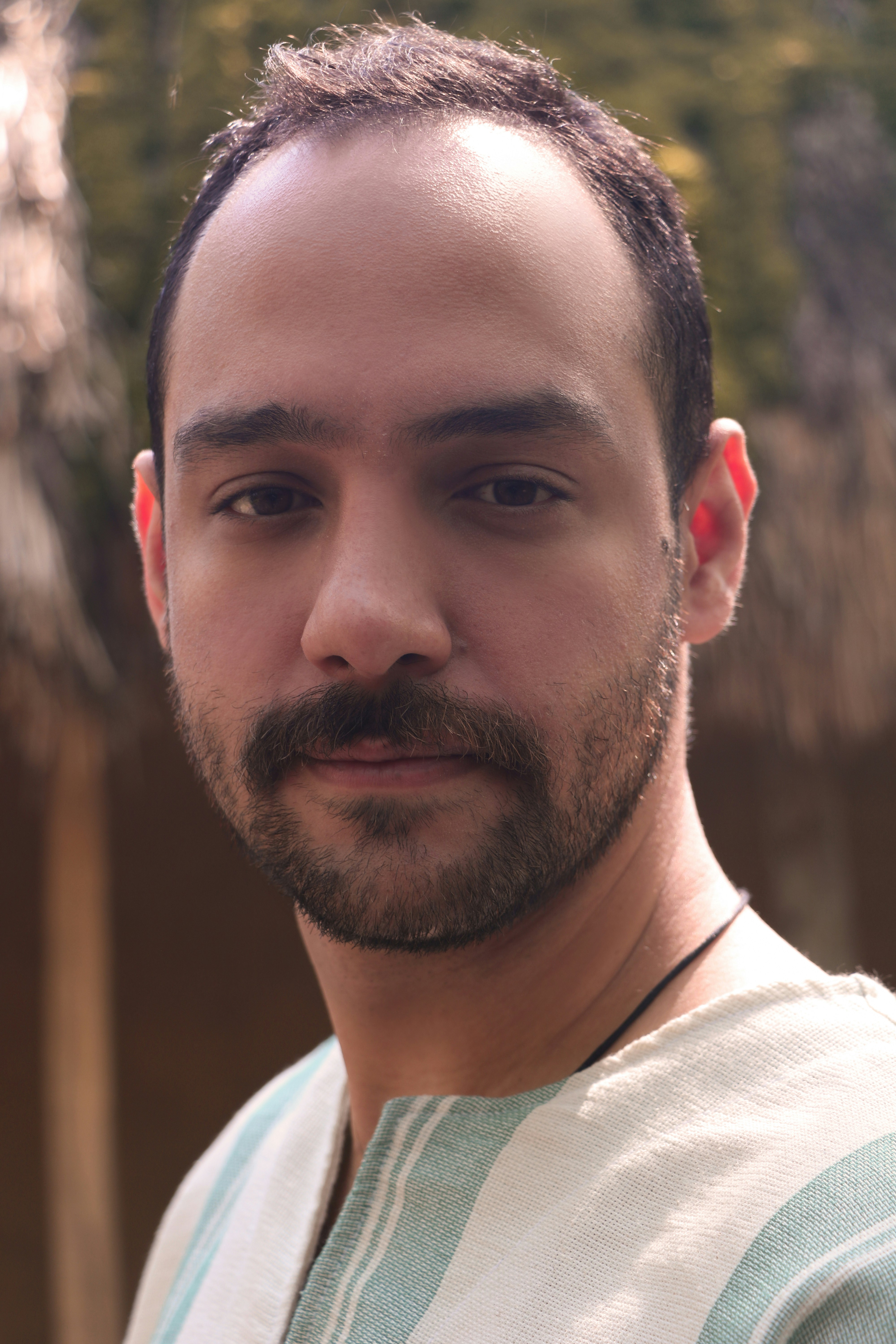 a close up of a person with a beard