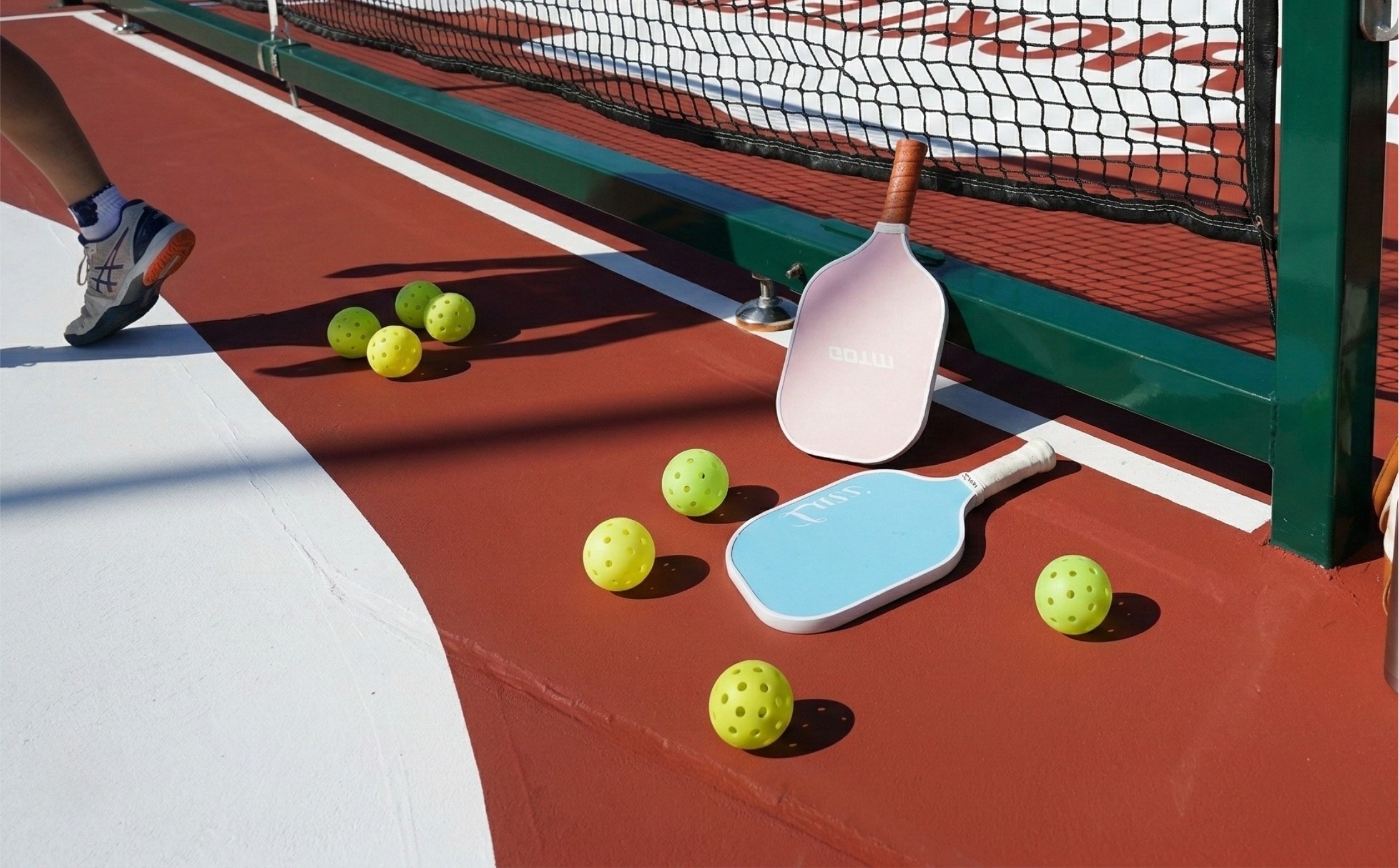 person showing pair of blue-and-white running shoes