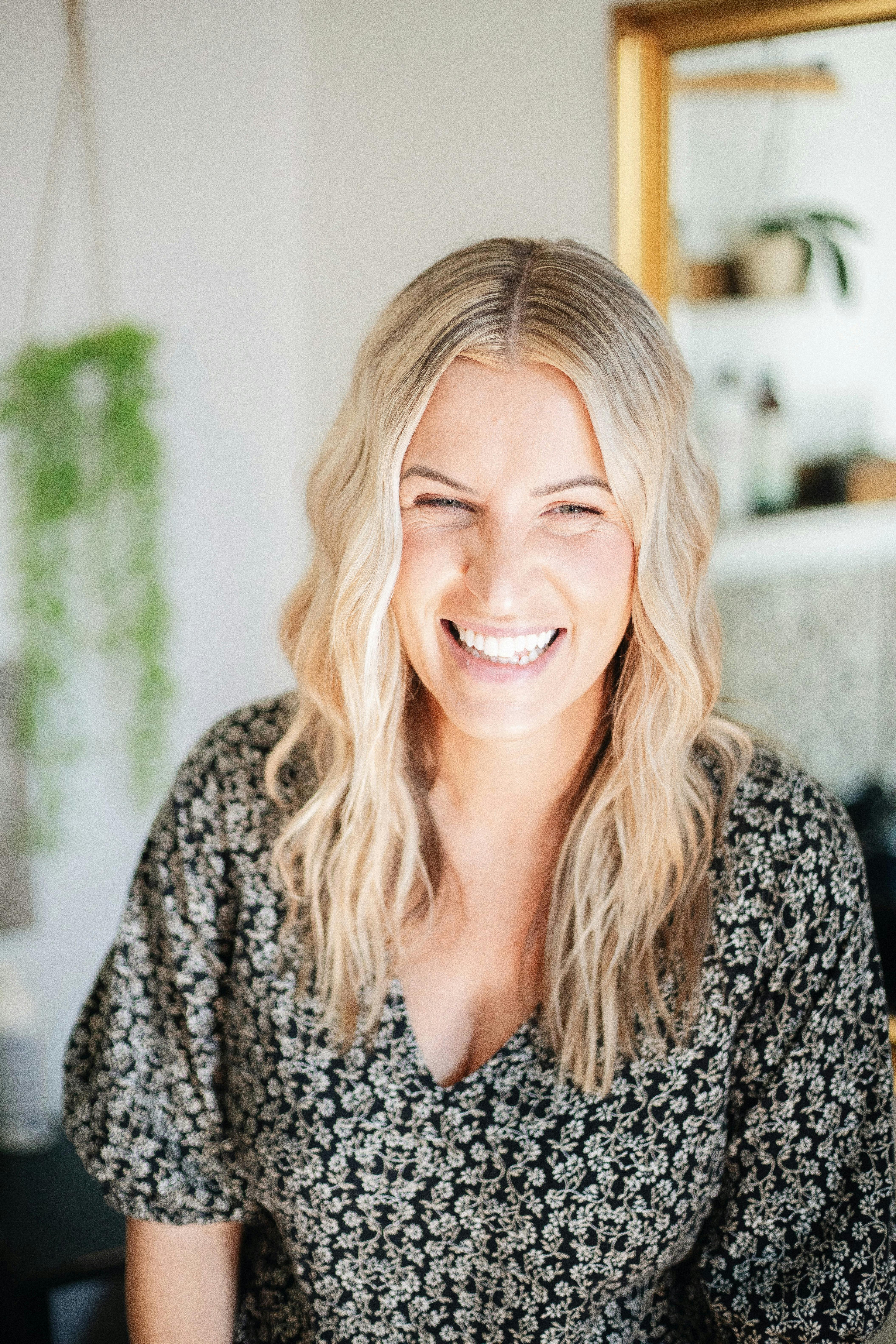 man wearing green crew-neck top and eyeglasses with black frames looking at side