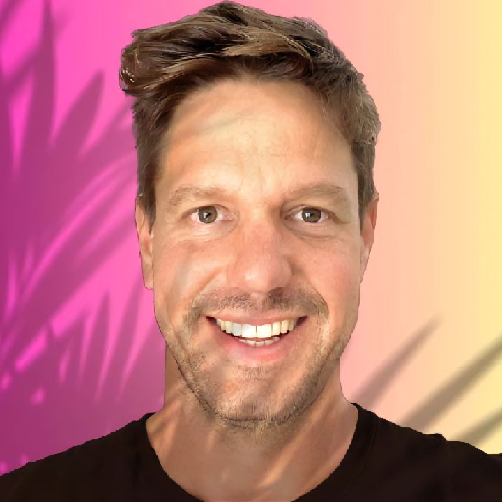 headshot of male in dark background