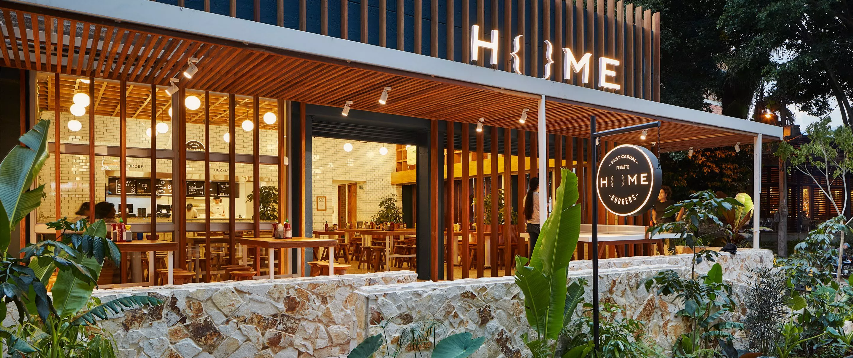 woman sitting on a red car
