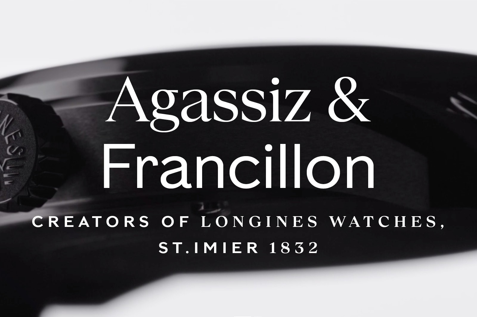 The image features a black-and-white sign with the names "Agassiz & Francillon" prominently displayed.
