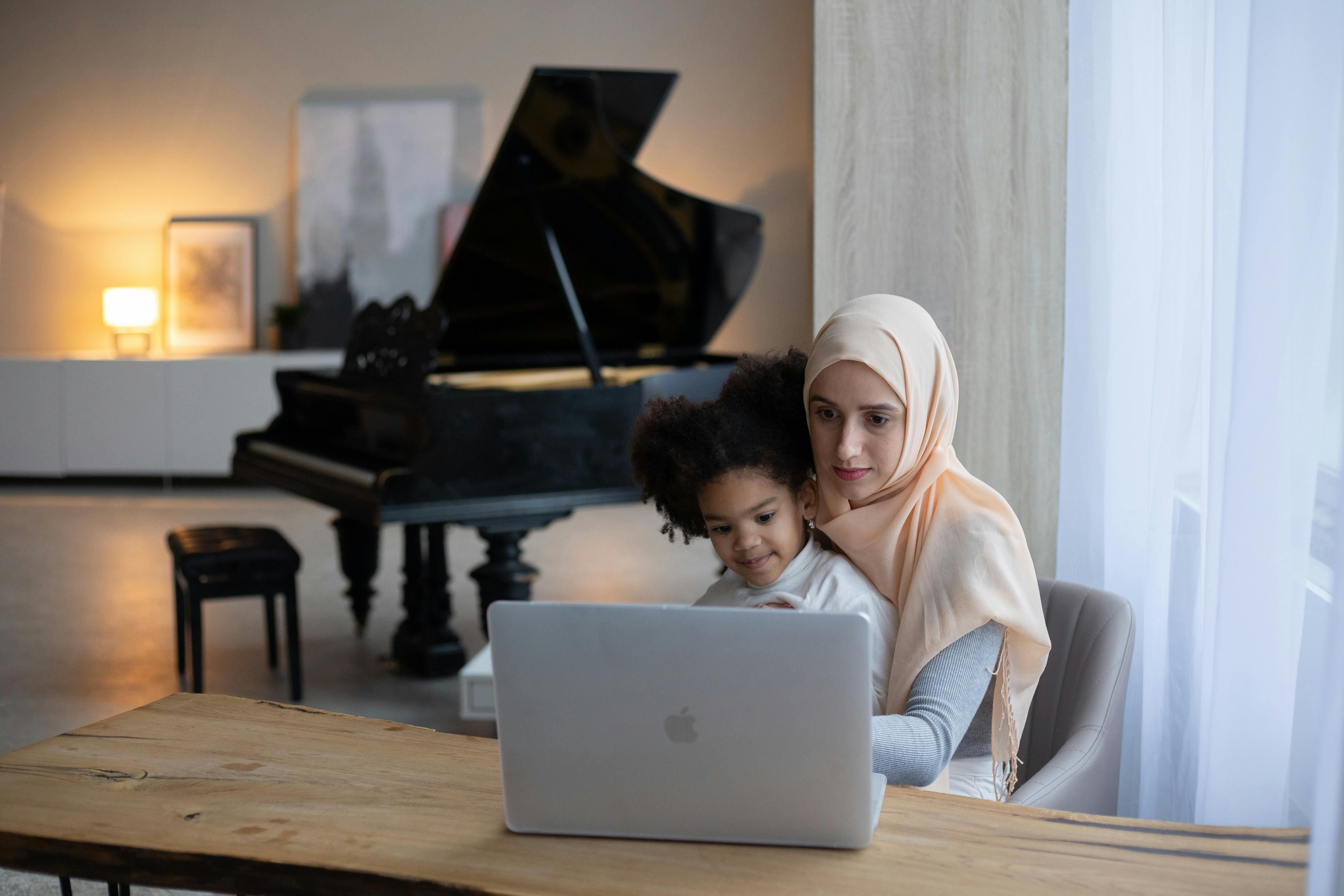 mother and child watching a family member's memorial video