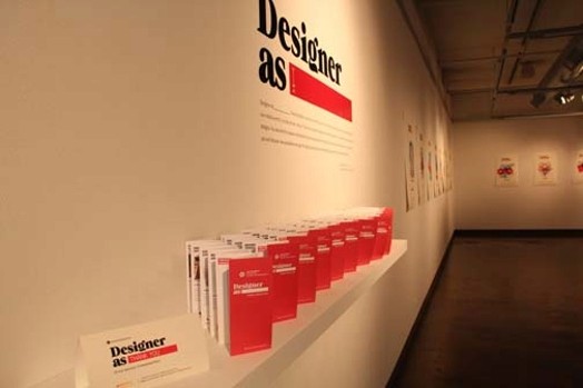 A shelf with flyers with red front page