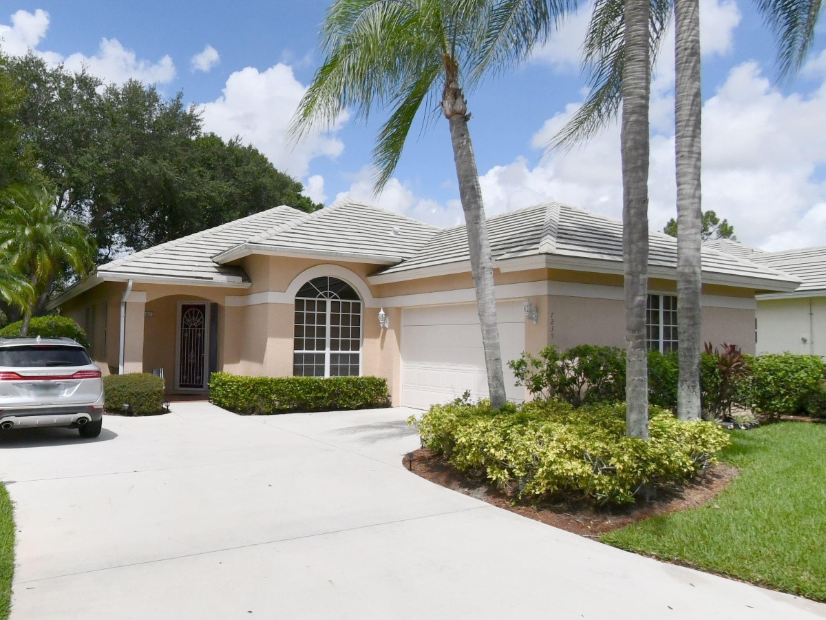 1996 New Roof Construction in Marsh Landing, PGA Village, Port St Lucie with Entegra Flat Broomswept Tile in Natural Gray