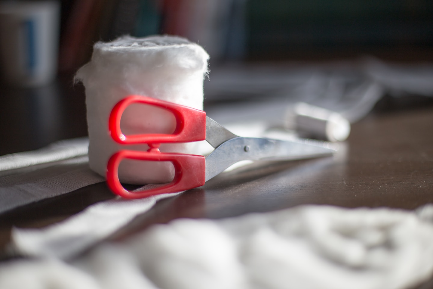 Shears and tailor's chalk on a length of cloth