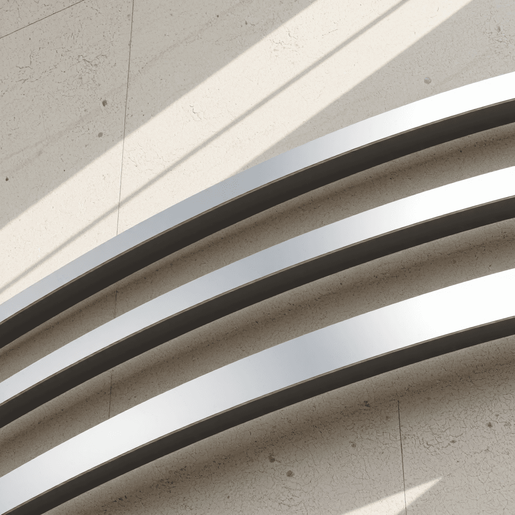 product photography of set of metal strips with a circular cutout, likely for construction or installation purposes