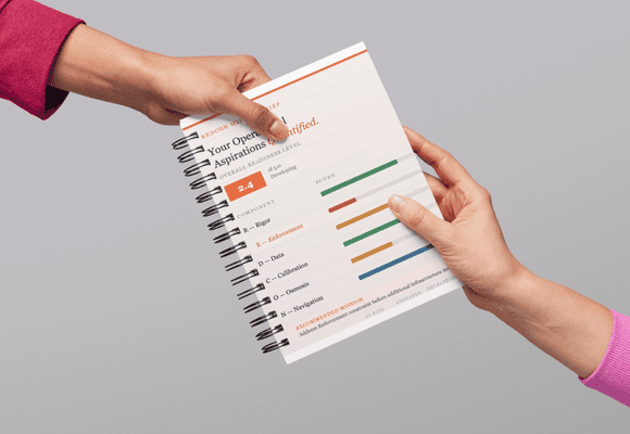 person holding orange book