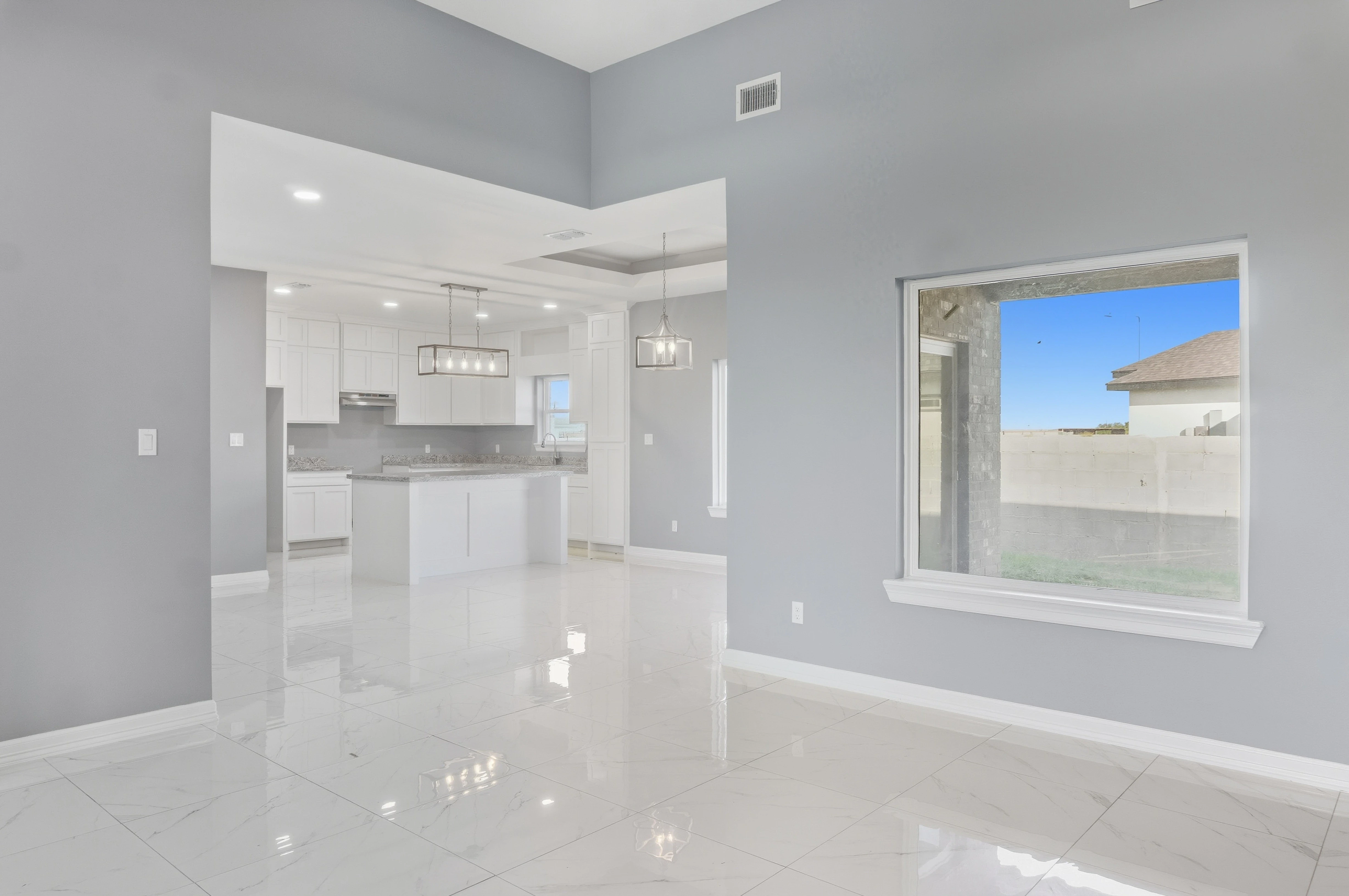 A picture of a house during twilight.