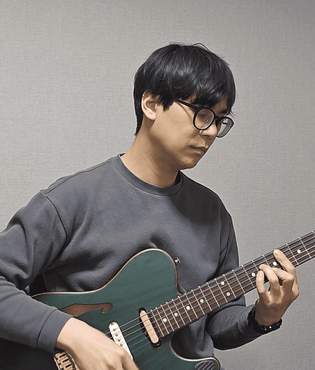 Newton Lee playing guitar