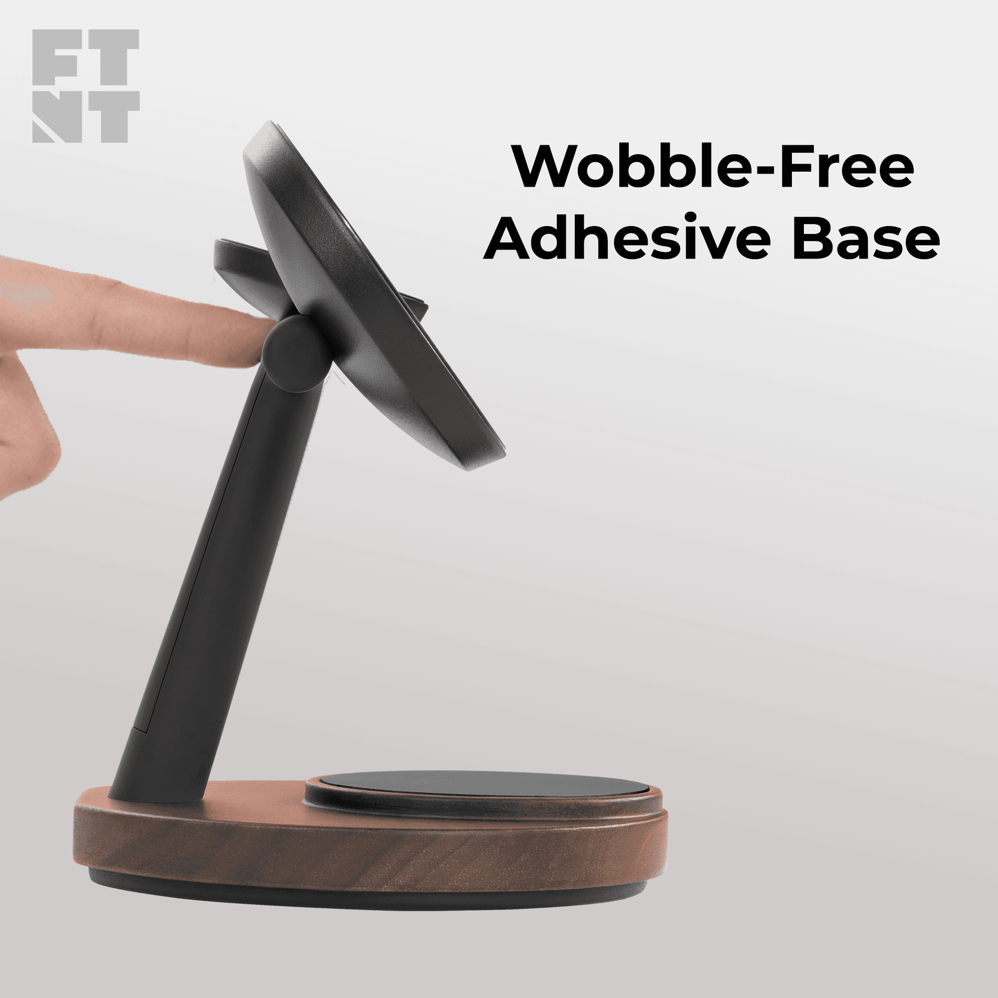 The image shows a hand interacting with a sleek, minimalist phone stand featuring a wobble-free adhesive base, designed to securely hold devices, highlighting its stability and innovative design associated with the ZenStand brand.