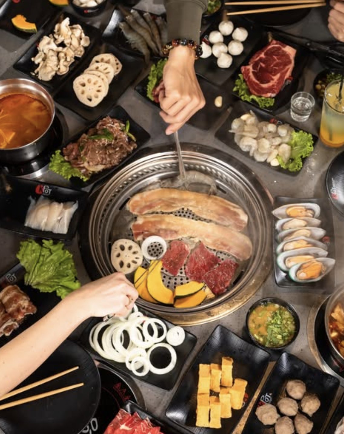 "KPOT Korean BBQ's buffet of house-made dipping sauces and condiments, perfect for customizing hot pot and barbecue dishes."