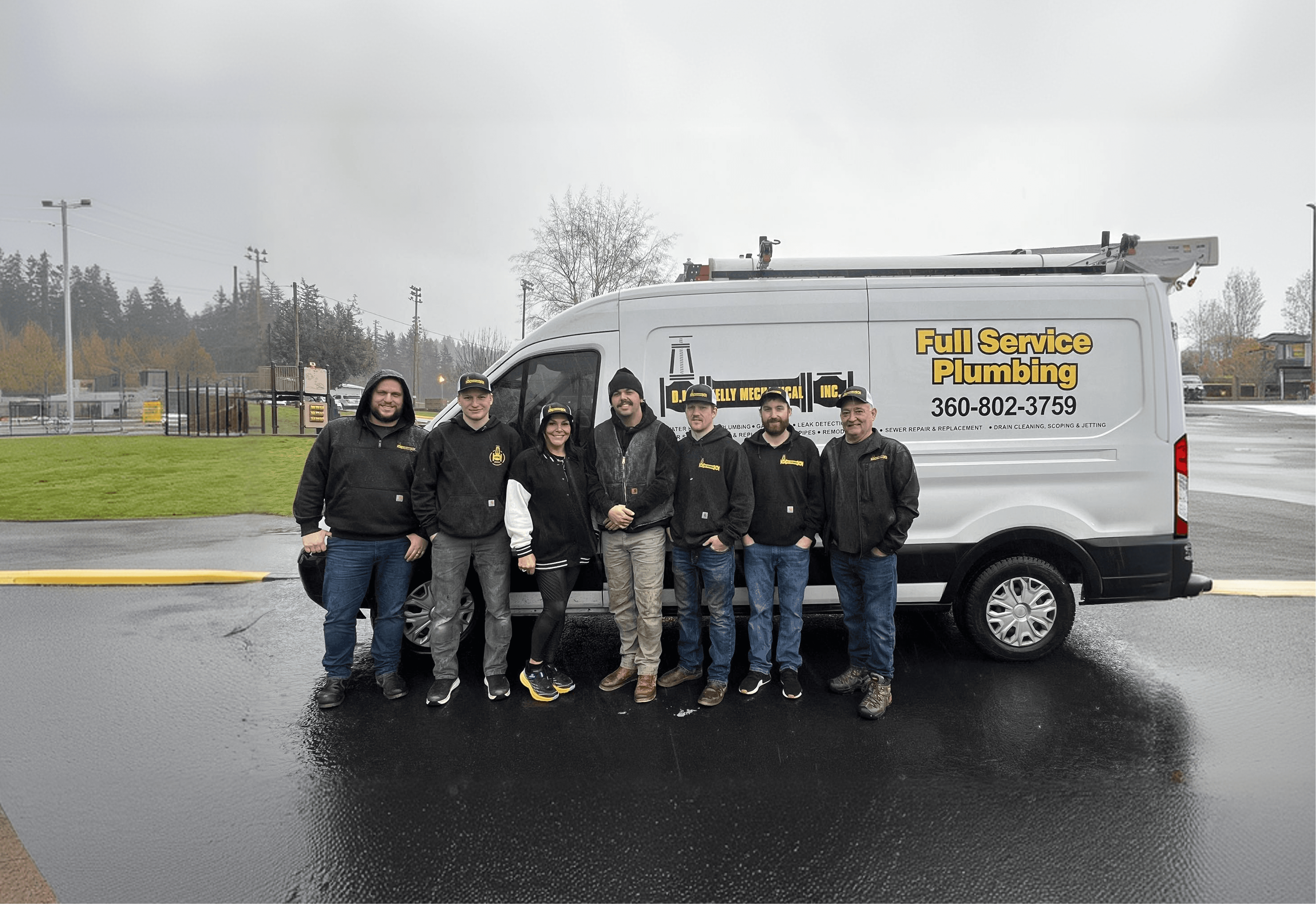 D.M. Kelly Mechanical plumbing team in front of service van in Enumclaw, Washington