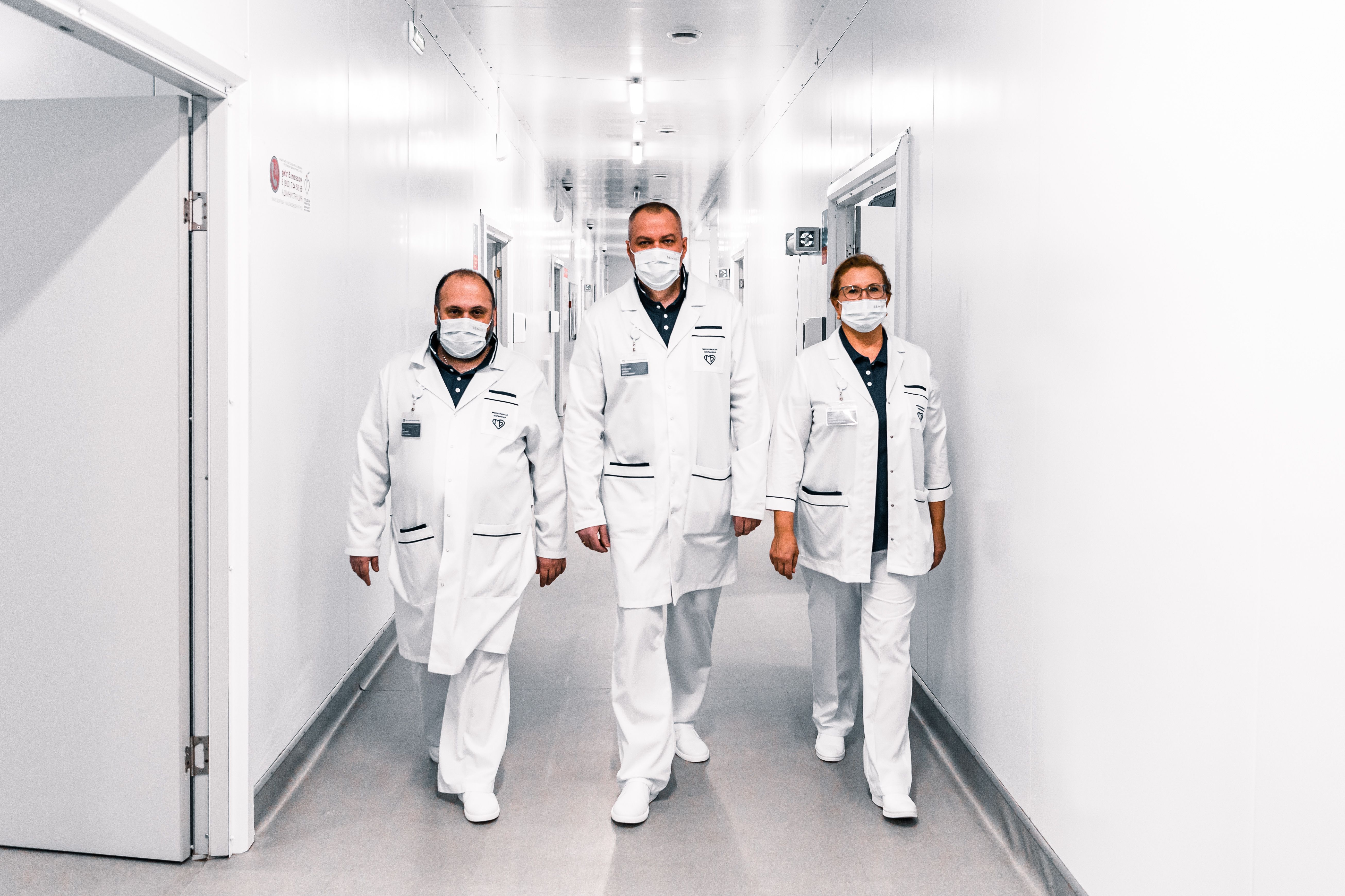 Medical professionals in a hospital hallway