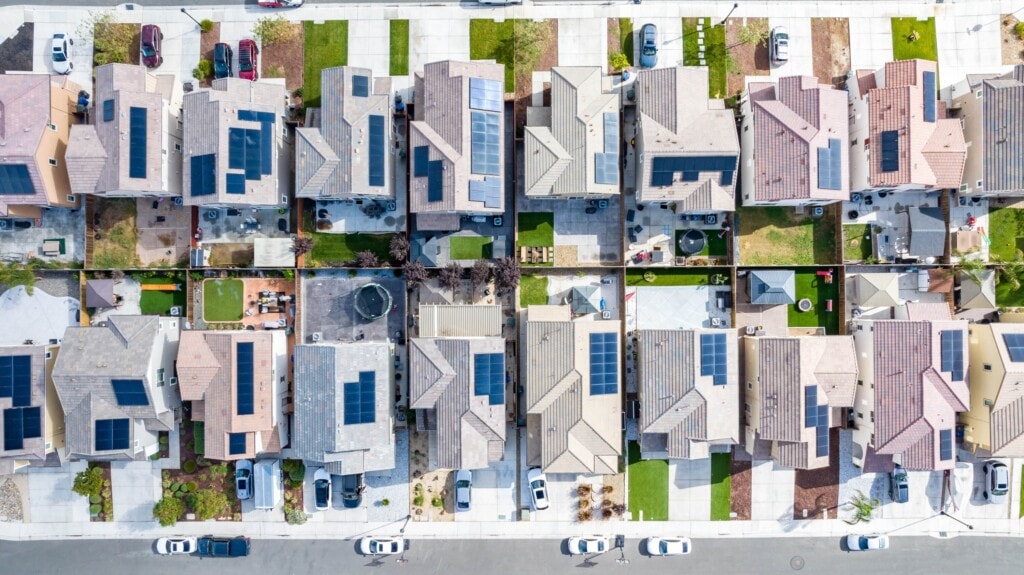 Arial view of houses with solar panels