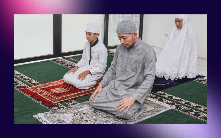 Family performing prayer together with a father and two children focused in Salah, demonstrating the concept of teaching by example in a prayer setting.