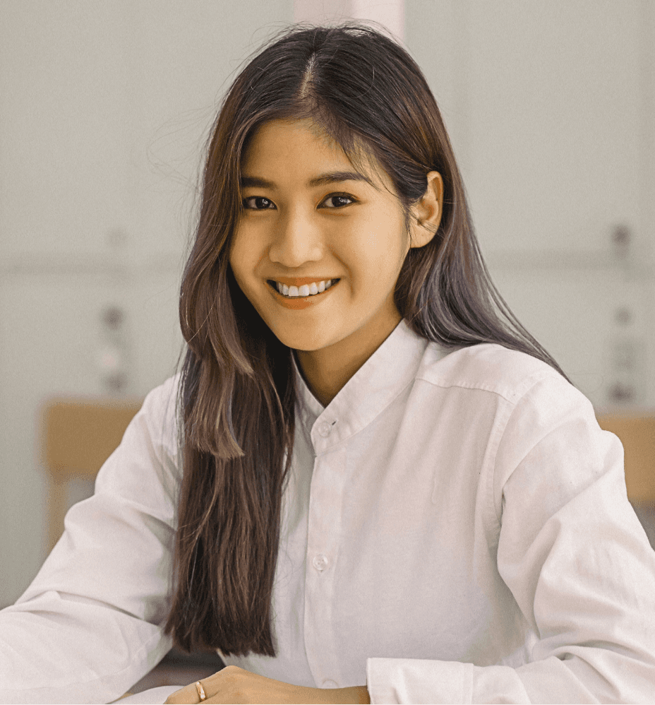 woman sitting around table holding tablet