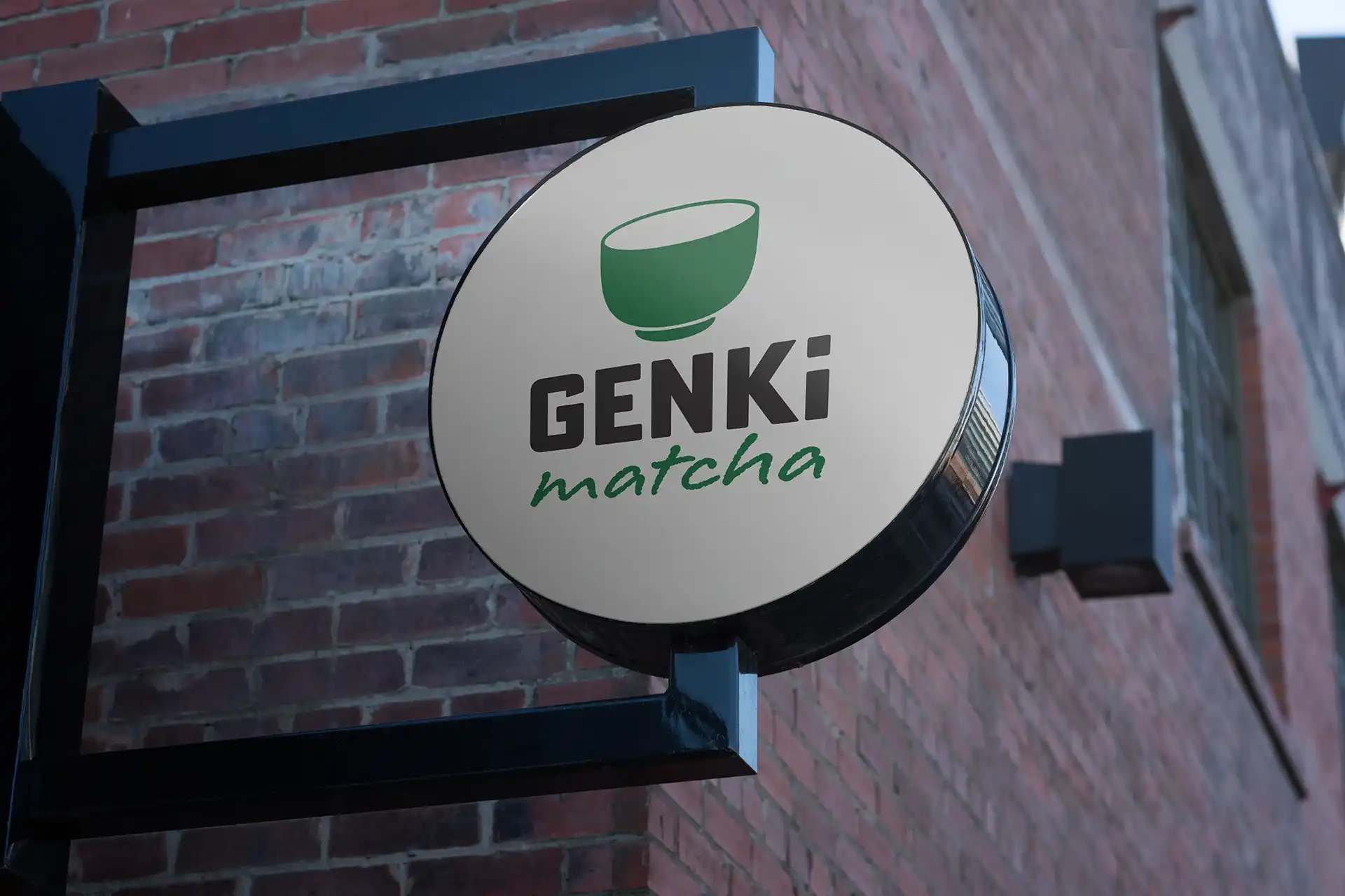Modern home office setup with a monitor, ergonomic chair, keyboard, and indoor plants near a window with blinds.