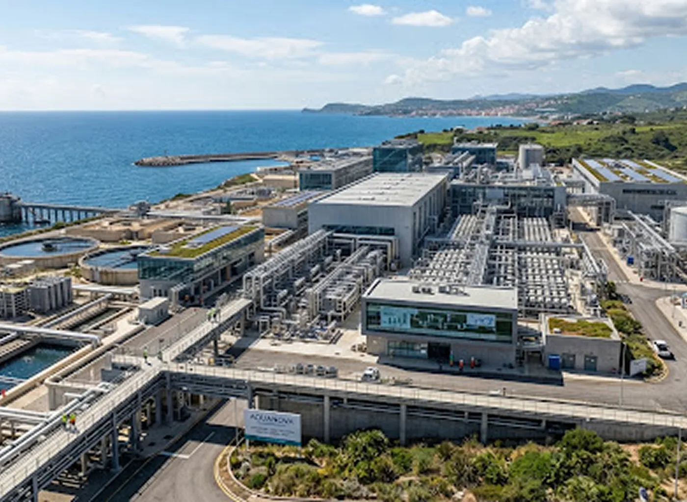 Aerial view of a coastal desalination plant beside the sea