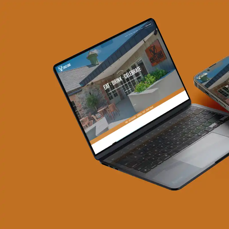 Mockup showing the cross guns website on a laptop