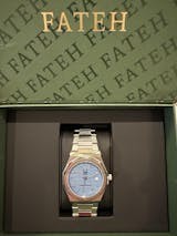 round silver-colored Rolex analog watch with link band