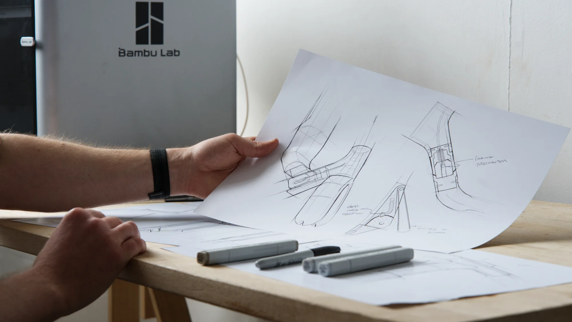 Industrial design concept sketches exploring form and technical details of a carbon fibre scooter frame.