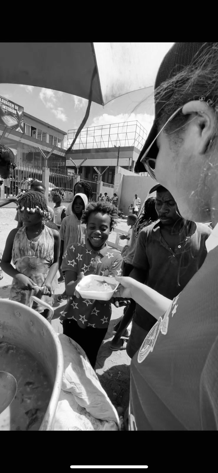 boy holding stock pot