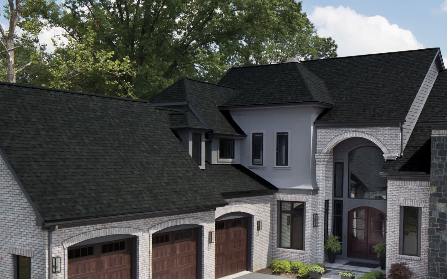 Beauty shot of a beautiful home with Owens Corning TruDefinition Duration shingles in Onyx Black color.