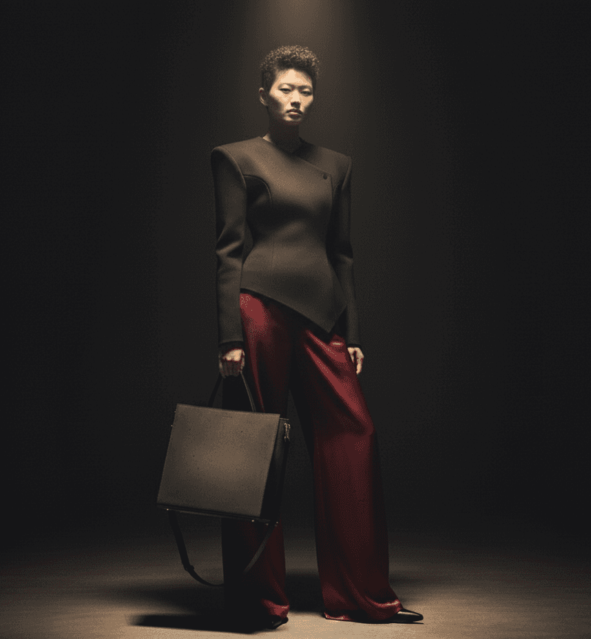 model carrying a luxury purse