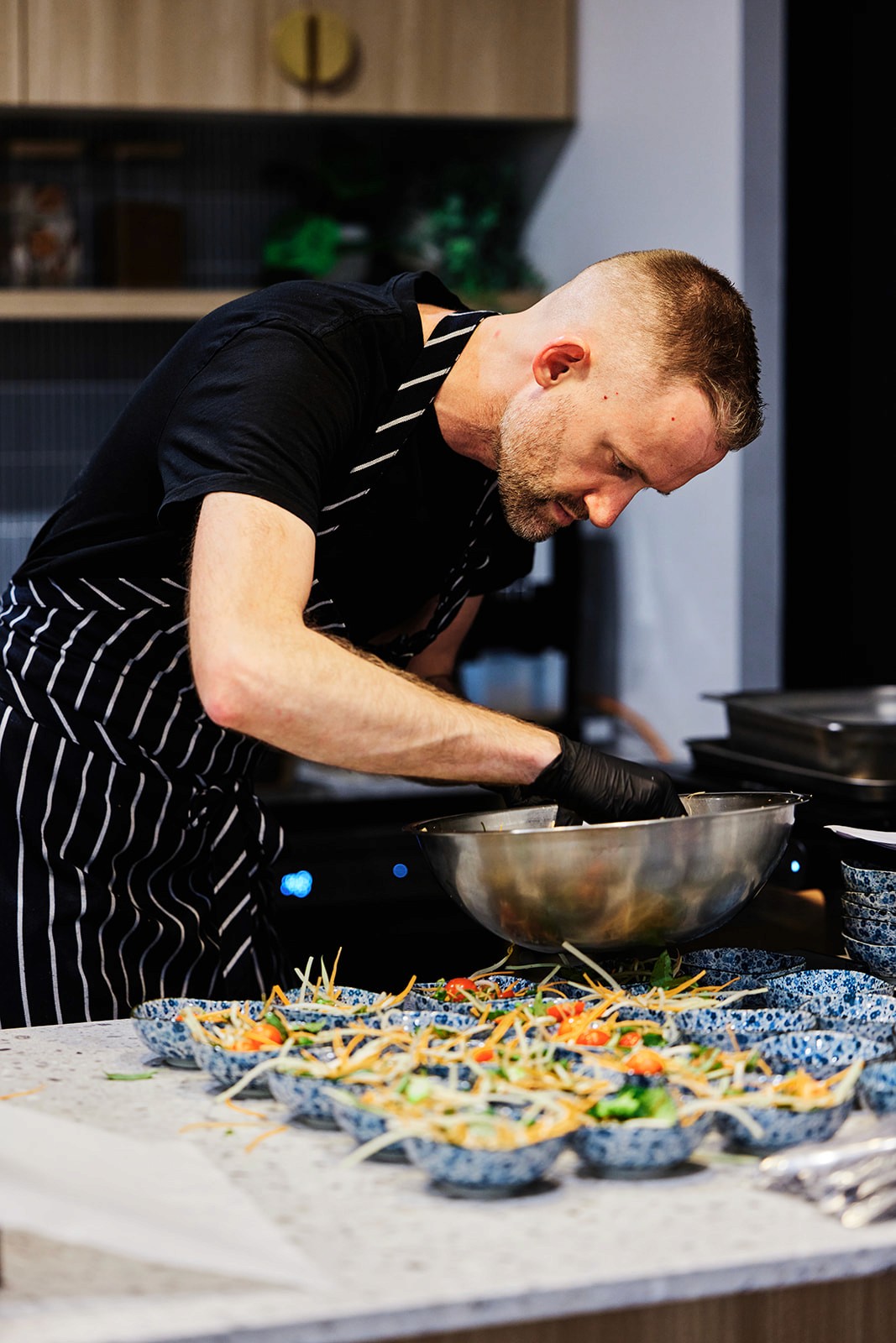 Chef preparing substantial canapes in a private home kitchen