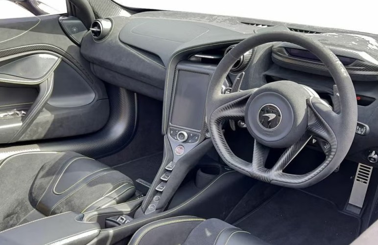a close up of a steering wheel and dashboard of a car