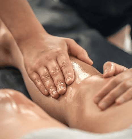 a woman getting a back massage at a spa